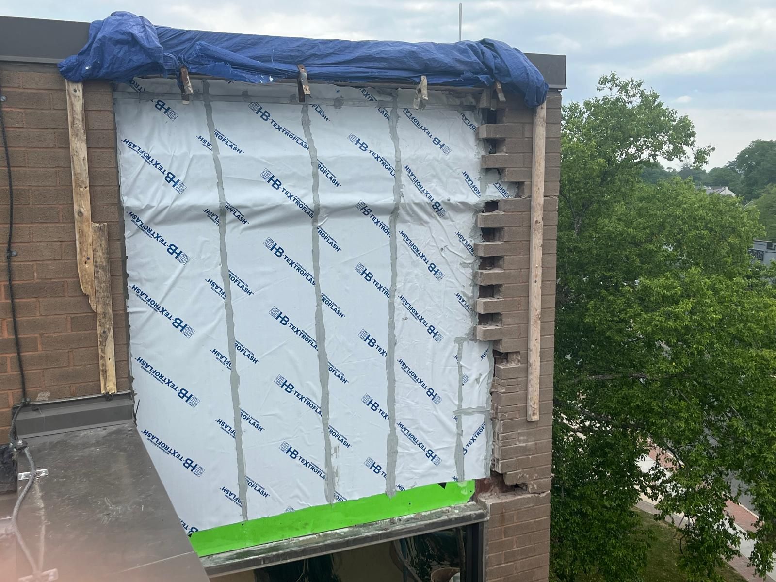 Exterior wall sheathing and weather barrier work